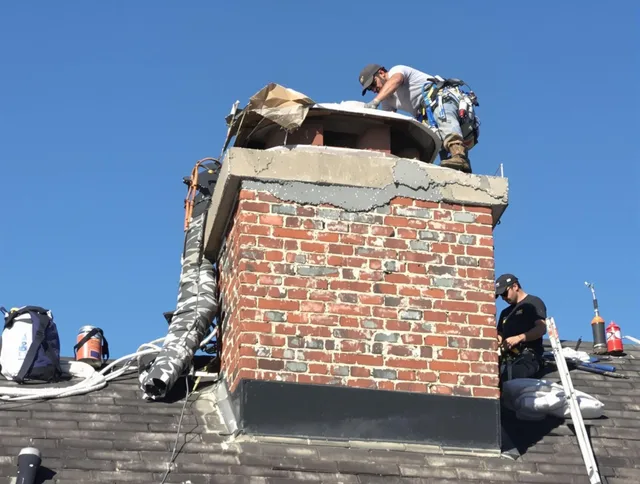 Bethel Chimney Sweep installing a custom chimney crown in Bethel, CT