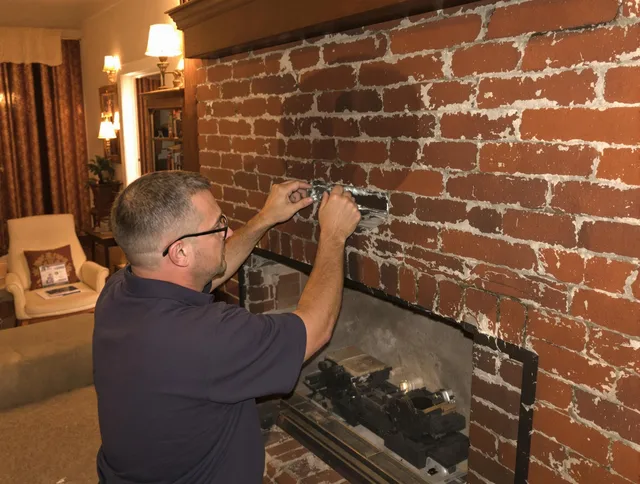 Bethel Chimney Sweep expert fixing a fireplace in Bethel, CT